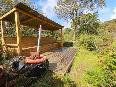 a wooden deck with a gazebo at Tickeydoo, Tor Down Quarry in Bodmin