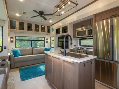 a kitchen and living room of an rv at Tickeydoo, Tor Down Quarry in Bodmin