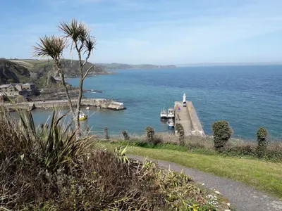 a view of a dock with boats in a body of water at Wild Air Guest House in Mevagissey