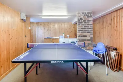 a ping pong table in a room with wooden walls at 3 Bed in Polruan oc-g30535 in Fowey