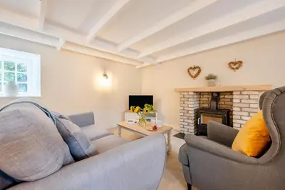 a living room with two couches and a fireplace at 2 Bed in St. Gluvias oc-c29724 in Ponsanooth