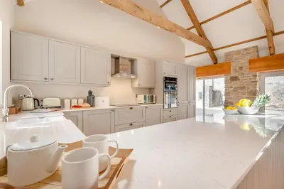a kitchen with white cabinets and a white counter top at 2 Bed in St. Gluvias oc-c29724 in Ponsanooth