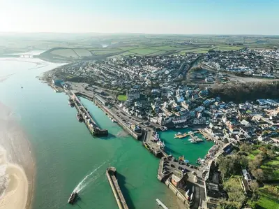 an aerial view of a city next to the water at Skylark House Padstow, Stylish Victorian Townhouse, Private Sauna, Cold Plunge and Log Burner in Padstow