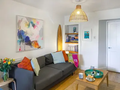 a living room with a couch and a table at Greycott - Uk48746 in Crantock