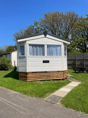 a mobile home sitting on the side of a road at Mounts Bay Caravan Park in Penzance