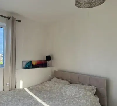 a bedroom with a bed and a window at Peaceful room near to beach - Newquay Porth in Saint Columb Minor