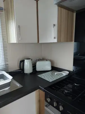 a kitchen with a counter top with appliances on it at Gateway to Cornwall in St Austell