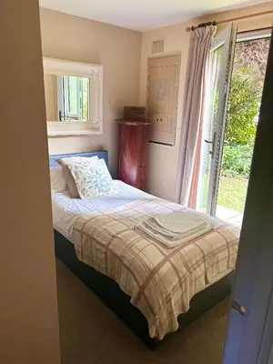 a bedroom with a bed and a window at Trevithick 46 in Hayle