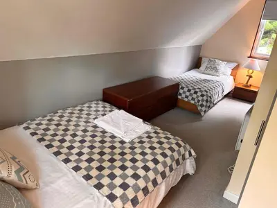 two beds in a small room with two beds at Trevithick 46 in Hayle