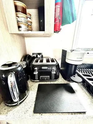 a kitchen counter top with a toaster and a toaster at Newquay Seaside Lodge Retreat with Hot Tub in Newquay