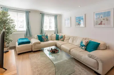 a living room with a couch and a glass table at The White House in Wadebridge