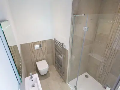 a bathroom with a shower and a toilet at 7 Atlantic Watch in St Ives