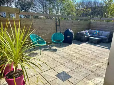 a patio with two chairs and a couch at Finest Retreats - Tamsin in Newquay