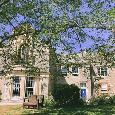 a bench sitting in front of a building at Epiphany House in Kenwyn