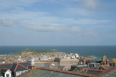 a view of a city with houses and the ocean at Rivendell Guest House in St Ives
