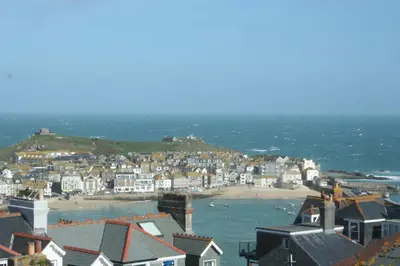 a view of a town with a beach and houses at Rivendell Guest House in St Ives