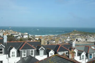 a view of a city with houses and the ocean at Rivendell Guest House in St Ives