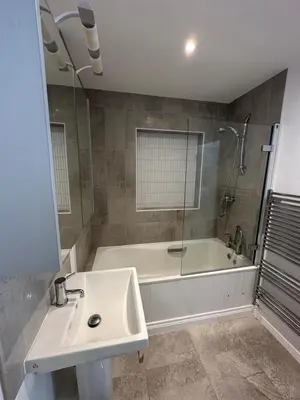 a bathroom with a sink and a bath tub at Rocksalt in Saint Minver