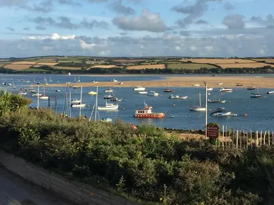 a bunch of boats floating in the water at Rocksalt in Saint Minver