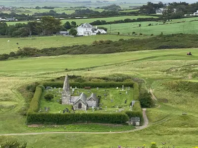 an old house in the middle of a green field at Rocksalt in Saint Minver