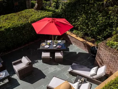 an overhead view of a table with a red umbrella at Hunters Moon in St Austell