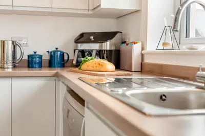 a kitchen counter with a sink and a loaf of bread at 3 Bed in Delabole oc-t30590 in Delabole
