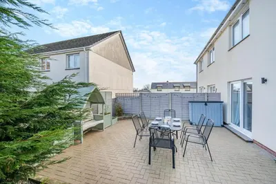 a patio with a table and chairs on it at 3 Bed in Delabole oc-t30590 in Delabole