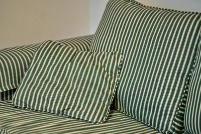 a couch with three pillows on top of it at Finest Retreats - Tregenna Court in Falmouth