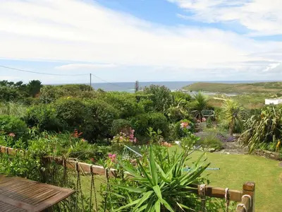 a garden with a view of the ocean at Cottage in Crantock, seaviews, 10min walk to beach in Crantock