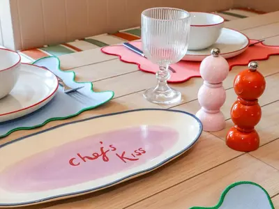 a table with a plate on top of a table at Mavericks Wave in St. Agnes