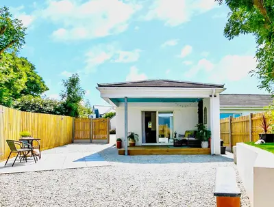 a home with a fence and a patio at The Studio in Bude