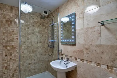 a bathroom with a sink and a shower at Finest Retreats - Harvest Moon in Newquay