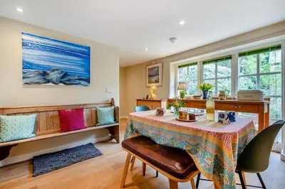 a dining room with a table and chairs at 2 Bed in St. Mawgan oc-l30651 in Saint Mawgan