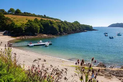 a beach with boats in a body of water at 2 Bed in Mawgan oc-c30671 in Mawgan