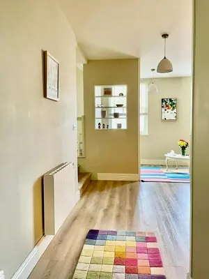a living room with a colorful rug on the floor at Apartment in Constantine in Constantine