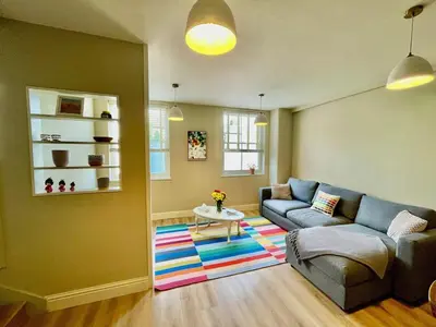 a living room with a couch and a table at Apartment in Constantine in Constantine