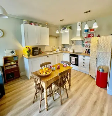 a kitchen with a table with a bowl of fruit on it at Apartment in Constantine in Constantine