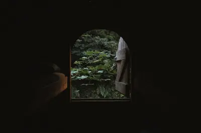 an open window with a view of a garden at Kudhva 2 in Treknow