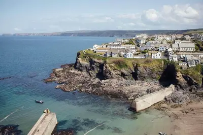 an aerial view of a town on a rocky coast at Charming Cottage & Garden in Port Isaac in Port Isaac
