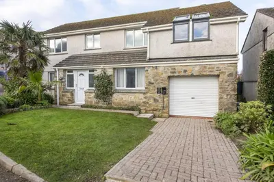 a house with a driveway and a garage at Ocean Parc in Carbis Bay