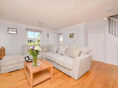 a living room with a couch and a table at Holiday Home Sea Compass by Interhome in Charlestown
