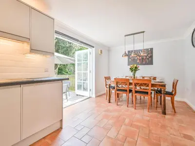 a kitchen and dining room with a table and chairs at Holiday Home Sea Compass by Interhome in Charlestown
