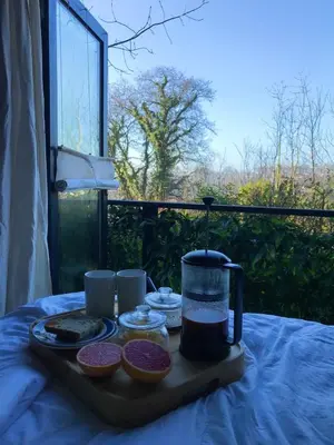 a tray with food and a drink on a table at Studio Portland in Falmouth