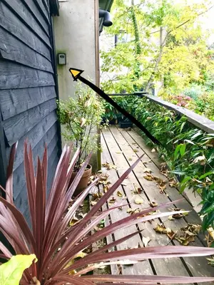 a stairway leading up to a house with a black arrow at Studio Portland in Falmouth