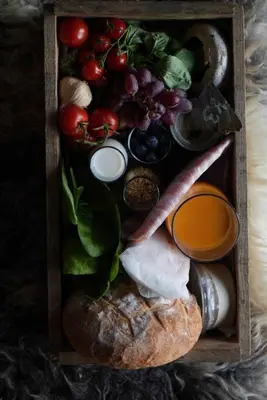 a wooden box filled with different types of food at Kudhva 3 in Treknow