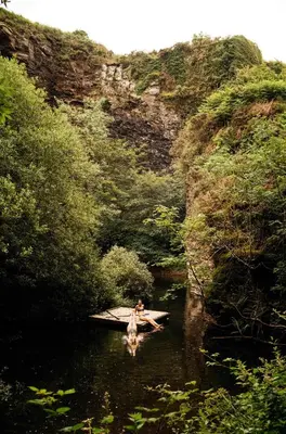 a person is standing in the water in a river at Kudhva 3 in Treknow