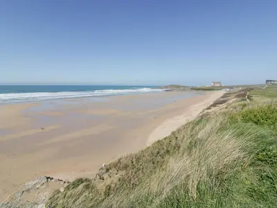 a view of a beach with the ocean in the background at Apartment 6 in Newquay
