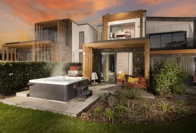 a house with a hot tub in the yard at Lefransa in Carbis Bay, St Ives in Carbis Bay