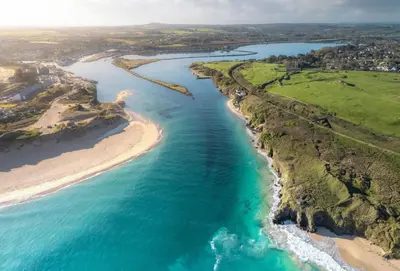 an aerial view of a beach and the ocean at Lefransa in Carbis Bay, St Ives in Carbis Bay