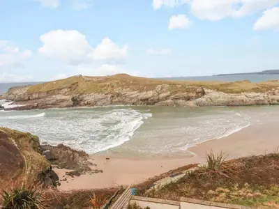 a beach on the coast of ireland at Driftwood in Newquay